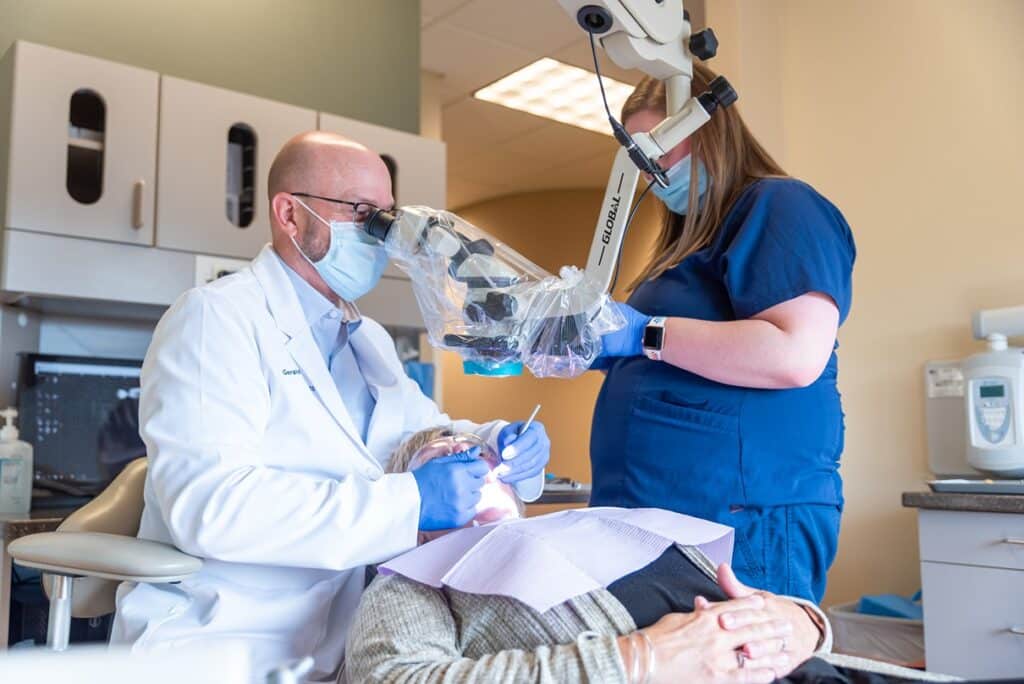 An endodontist performing a root canal in Rochester, MN